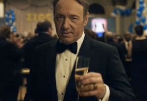 Kevin Spacey raising a toast