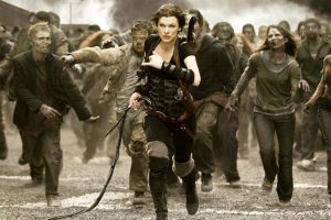 Milla Jovovich running from zombies in Resident Evil