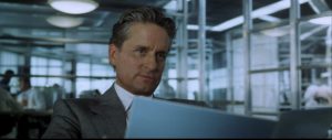 Michael Douglas reads documents before the game begins