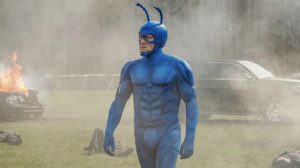The Tick walks out of an explosion