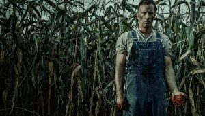 Thomas Jane stand in a corn field with blood on his hands for 1922