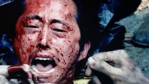 Glenn surrounded by zombies in the Walking Dead