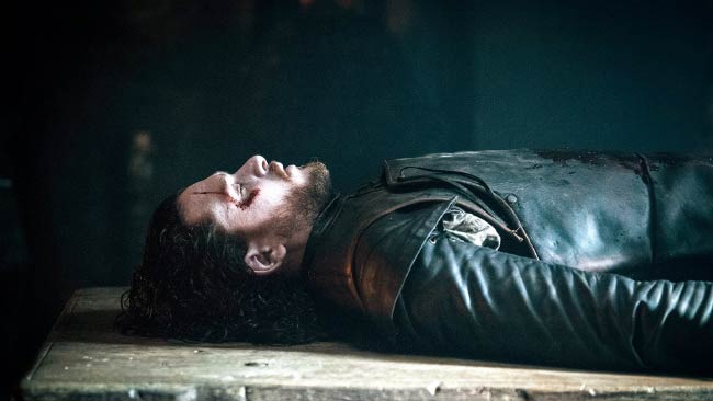 Jon Snow laying on table in The Red Woman