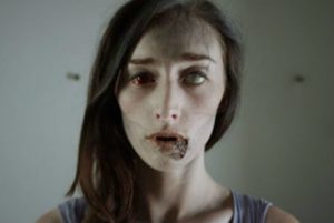 Samantha looks in the mirror not liking what she sees.