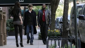 White Mike walks down a New York City street.