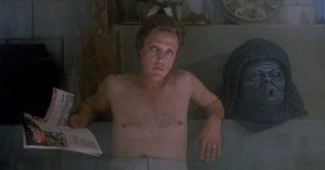 Christopher Walken reads a magazine