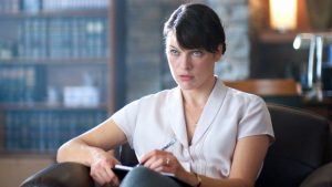 Milla Jovovich writing notes on a pad