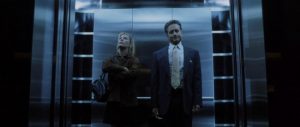 Michael Douglas rides in elevator during the Game