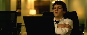 Jesse Eisenberg leans back in the Social Network