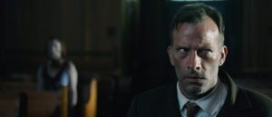 Thomas Jane sits in church during 1922