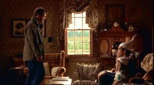 Mel Gibson, as Reverend Graham, confronts his family in Signs 
