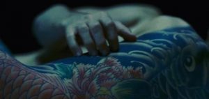Jared Leto strokes Miyu's tattoos in The Outsider