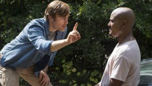 A nameless doctor helps a blind priest in The Walking Dead