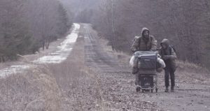 The Man and the Boy walk down The Road