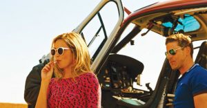 Jen gets off a helicopter in Revenge