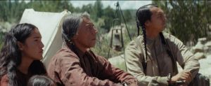 Wes Studi, Adam Beach, and Q'orianka Kilcher in Hostiles.