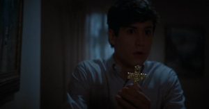 Charley protecting himself with a cross in Fright Night