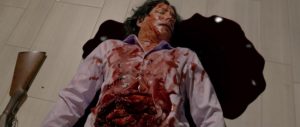 Richard Grieco in a pool of his own blood in Art of the Dead