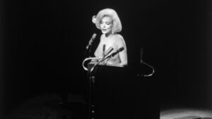 Marilyn Monroe sings "Happy Birthday, Mr. President" to John F. Kennedy. 